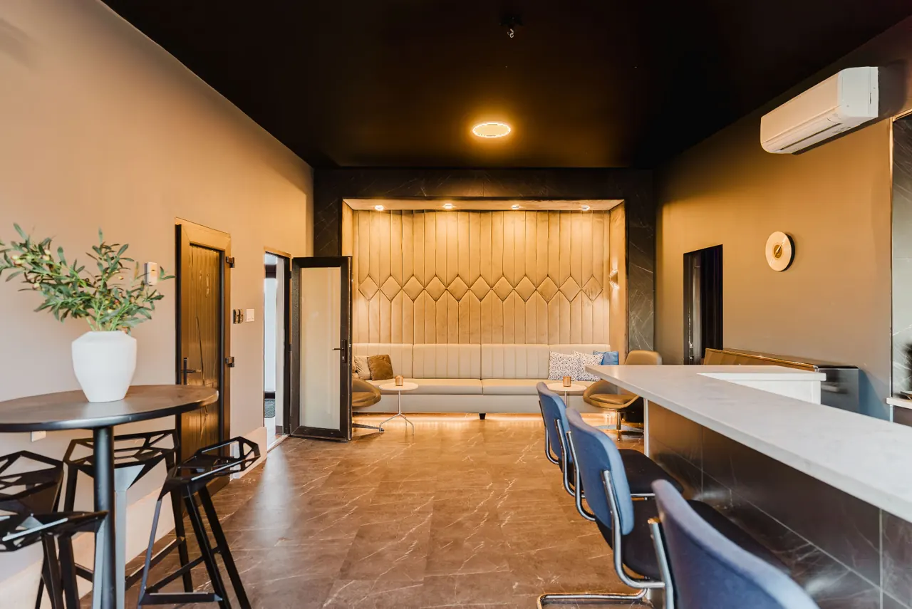 Lounge seating and counter viewed from the opposite angle — GCO interior work in Ottawa