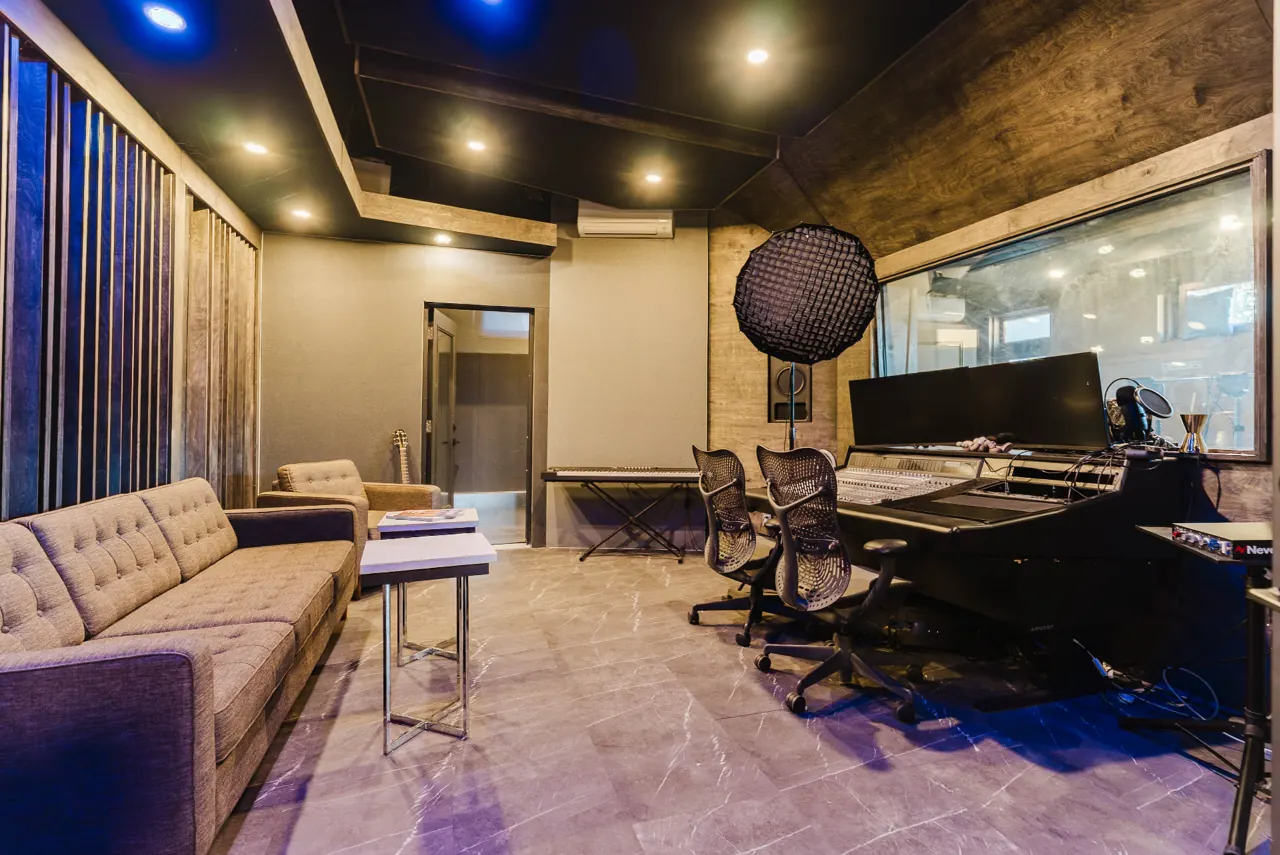 Recording studio with a mixing desk and acoustic wall finishes — GCO interior work in Ottawa