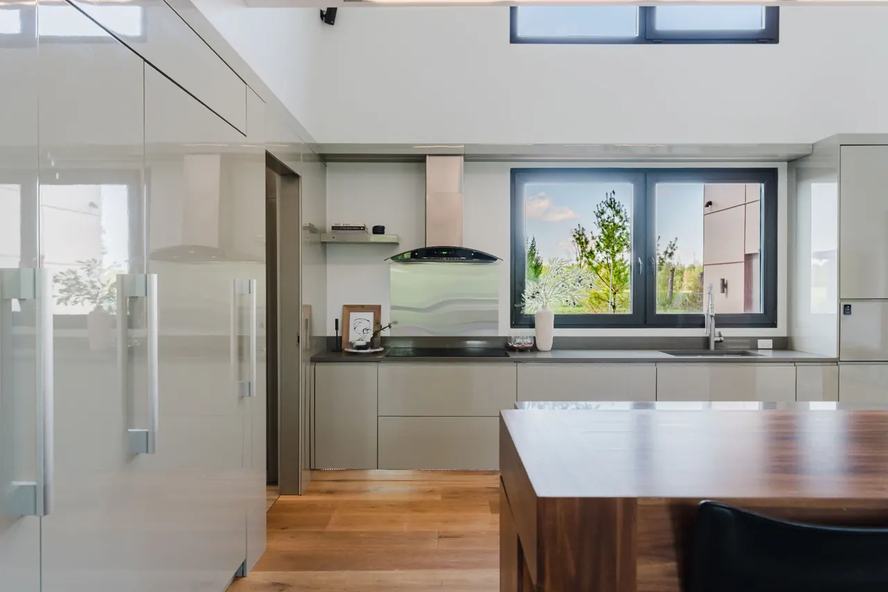 Kitchen with glossy cabinetry and a wood island — GCO work in Ottawa